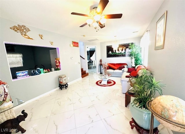 8156 Blue Hope Diamond Ln, Las Vegas, NV 89139 - living area featuring stairs, ceiling fan, marble finish flooring, and baseboards