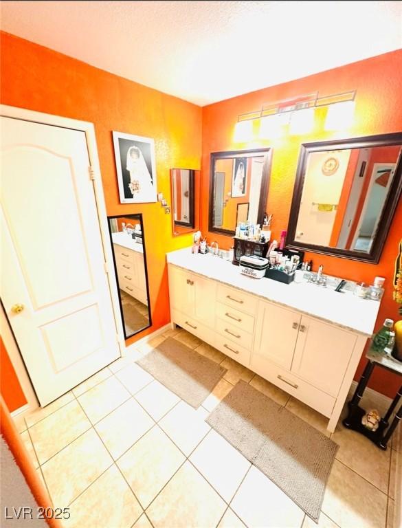 8156 Blue Hope Diamond Ln, Las Vegas, NV 89139 - full bath featuring double vanity and tile patterned flooring