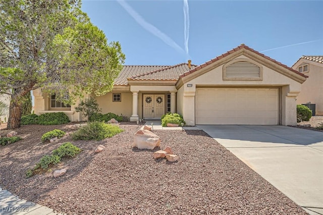 3104 Hayden Ct, Las Vegas, NV 89134 - view of front of house with driveway, a garage, stucco siding, and a tiled roof