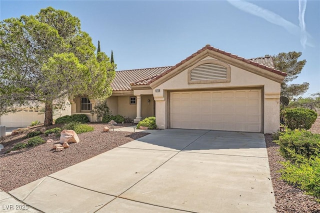 3104 Hayden Ct, Las Vegas, NV 89134 - view of front of house with stucco siding, a tiled roof, concrete driveway, and a garage