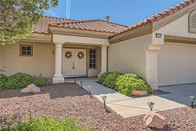 3104 Hayden Ct, Las Vegas, NV 89134 - entrance to property featuring a tile roof, stucco siding, and a garage