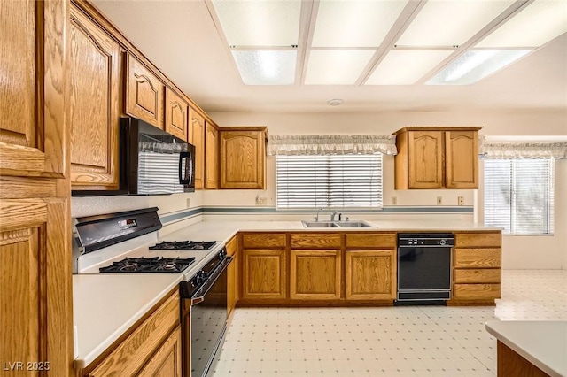 3104 Hayden Ct, Las Vegas, NV 89134 - kitchen featuring black appliances, light floors, light countertops, and healthy amount of natural light