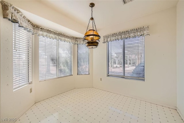 3104 Hayden Ct, Las Vegas, NV 89134 - spare room featuring tile patterned floors, plenty of natural light, and a chandelier