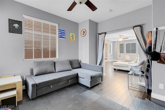 7937 Granite Walk Ave, Las Vegas, NV 89178 - living room featuring a ceiling fan and baseboards