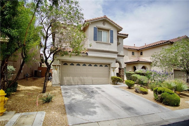 9144 Clear Sky Ave, Las Vegas, NV 89178 - mediterranean / spanish-style house with an attached garage, stucco siding, a tiled roof, driveway, and central AC