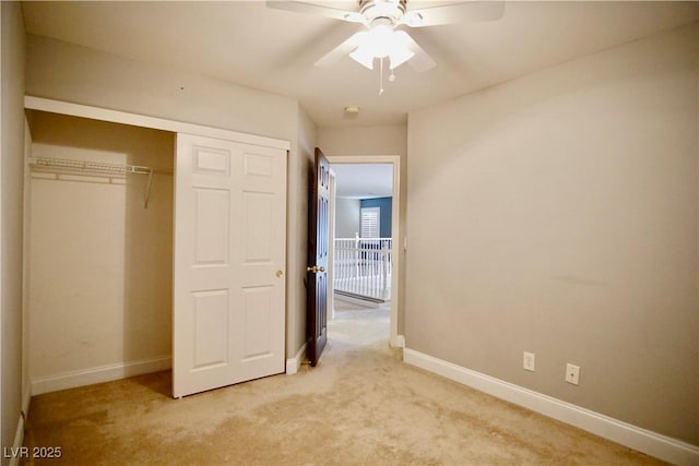 9144 Clear Sky Ave, Las Vegas, NV 89178 - unfurnished bedroom featuring light carpet, baseboards, a closet, and a ceiling fan