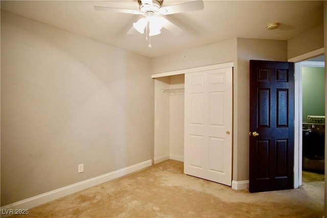 9144 Clear Sky Ave, Las Vegas, NV 89178 - unfurnished bedroom with carpet, a closet, baseboards, a ceiling fan, and washer / clothes dryer