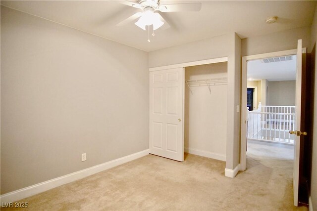 9144 Clear Sky Ave, Las Vegas, NV 89178 - unfurnished bedroom featuring light carpet, baseboards, a closet, and a ceiling fan