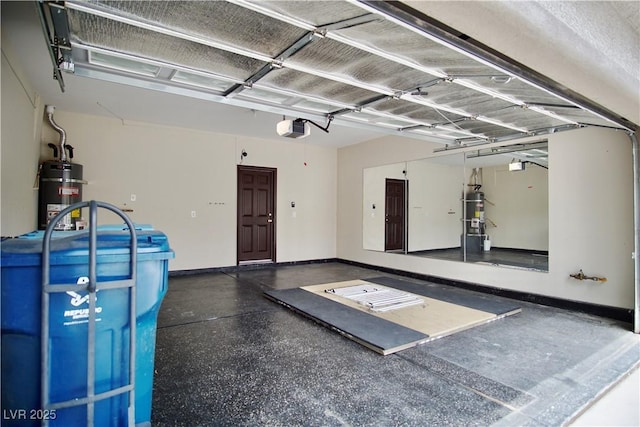 9144 Clear Sky Ave, Las Vegas, NV 89178 - garage featuring secured water heater, a garage door opener, and baseboards