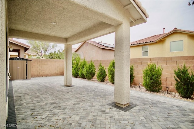9144 Clear Sky Ave, Las Vegas, NV 89178 - fenced backyard with a patio area