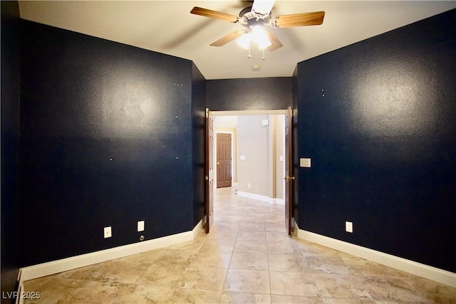 9144 Clear Sky Ave, Las Vegas, NV 89178 - empty room featuring a ceiling fan, baseboards, and light tile patterned flooring