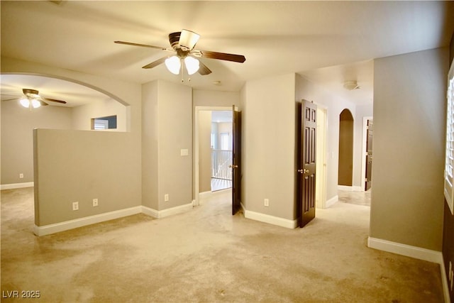9144 Clear Sky Ave, Las Vegas, NV 89178 - spare room featuring arched walkways, a ceiling fan, carpet, and baseboards