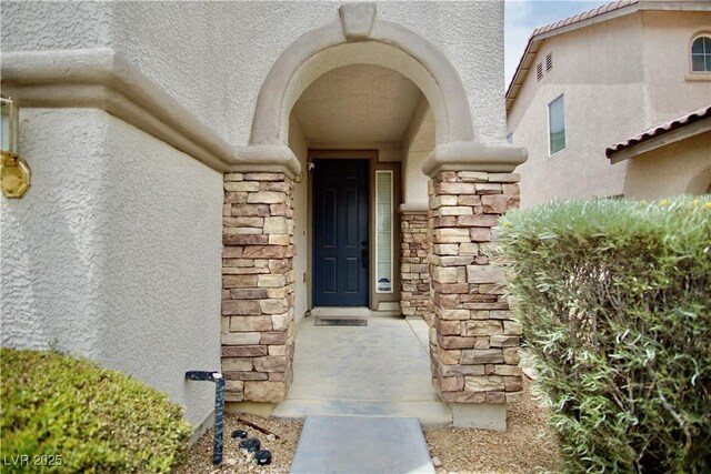 9144 Clear Sky Ave, Las Vegas, NV 89178 - doorway to property with stucco siding and stone siding
