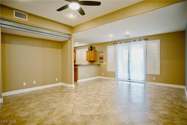 9144 Clear Sky Ave, Las Vegas, NV 89178 - unfurnished living room featuring ceiling fan and baseboards