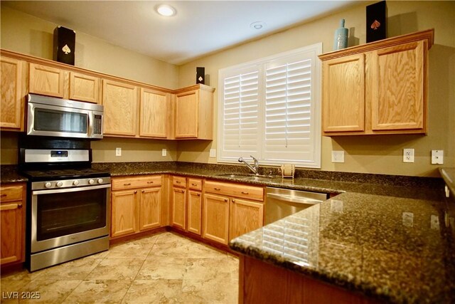 9144 Clear Sky Ave, Las Vegas, NV 89178 - kitchen with stainless steel appliances, a sink, dark stone countertops, and recessed lighting