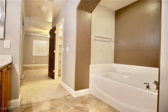 9144 Clear Sky Ave, Las Vegas, NV 89178 - full bath featuring vanity, a garden tub, and baseboards