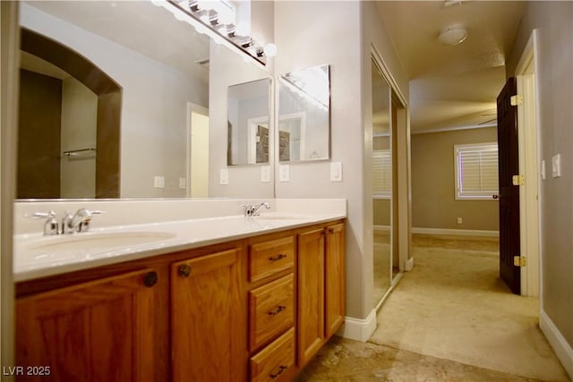 9144 Clear Sky Ave, Las Vegas, NV 89178 - bathroom featuring double vanity and baseboards