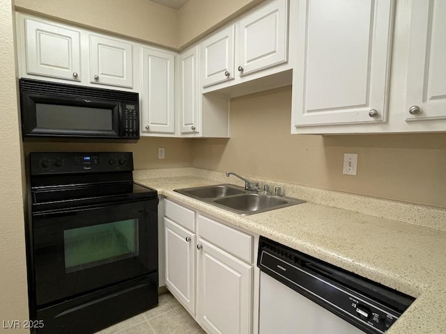 3151 Soaring Gulls Dr Unit 2147, Las Vegas, NV 89128 - kitchen with black appliances, a sink, white cabinets, and light countertops