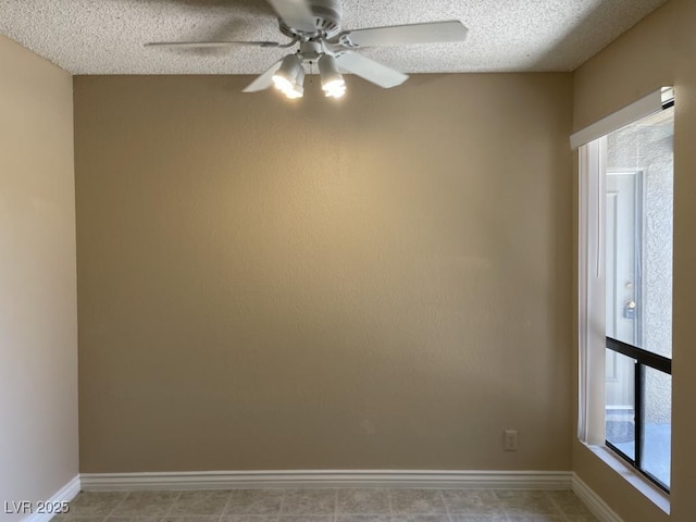 3151 Soaring Gulls Dr Unit 2147, Las Vegas, NV 89128 - spare room featuring a ceiling fan, a textured ceiling, and baseboards
