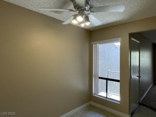 3151 Soaring Gulls Dr Unit 2147, Las Vegas, NV 89128 - spare room featuring ceiling fan, a textured ceiling, and baseboards