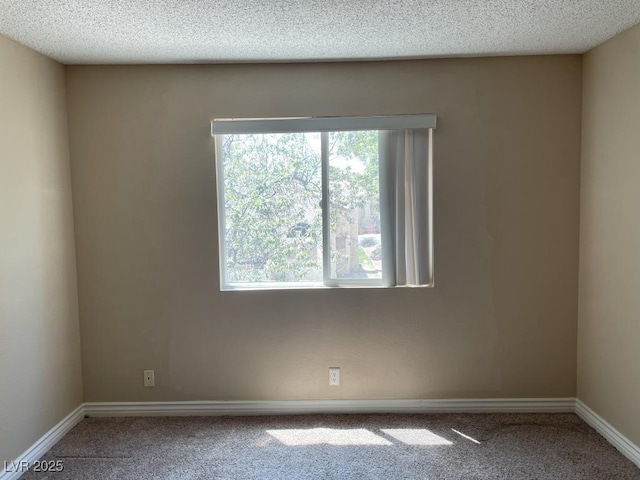 3151 Soaring Gulls Dr Unit 2147, Las Vegas, NV 89128 - carpeted spare room featuring healthy amount of natural light, baseboards, and a textured ceiling