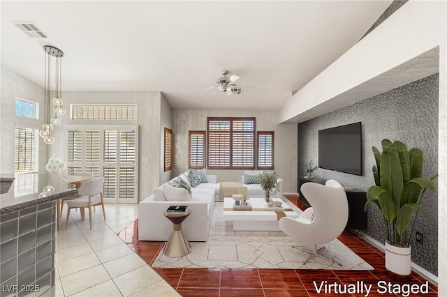 9688 Meeks Bay Ave, Las Vegas, NV 89148 - living area featuring healthy amount of natural light, ceiling fan, wallpapered walls, tile patterned flooring, and baseboards