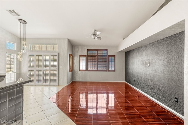 9688 Meeks Bay Ave, Las Vegas, NV 89148 - unfurnished living room with tile patterned flooring, ceiling fan, healthy amount of natural light, and baseboards