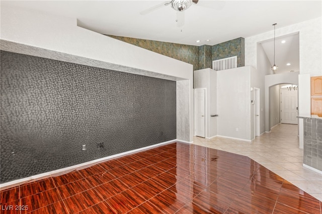 9688 Meeks Bay Ave, Las Vegas, NV 89148 - unfurnished room with ceiling fan, arched walkways, light tile patterned flooring, a high ceiling, and recessed lighting