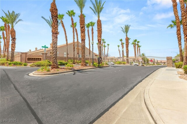 9688 Meeks Bay Ave, Las Vegas, NV 89148 - view of asphalt street with curbs, street lighting, and sidewalks