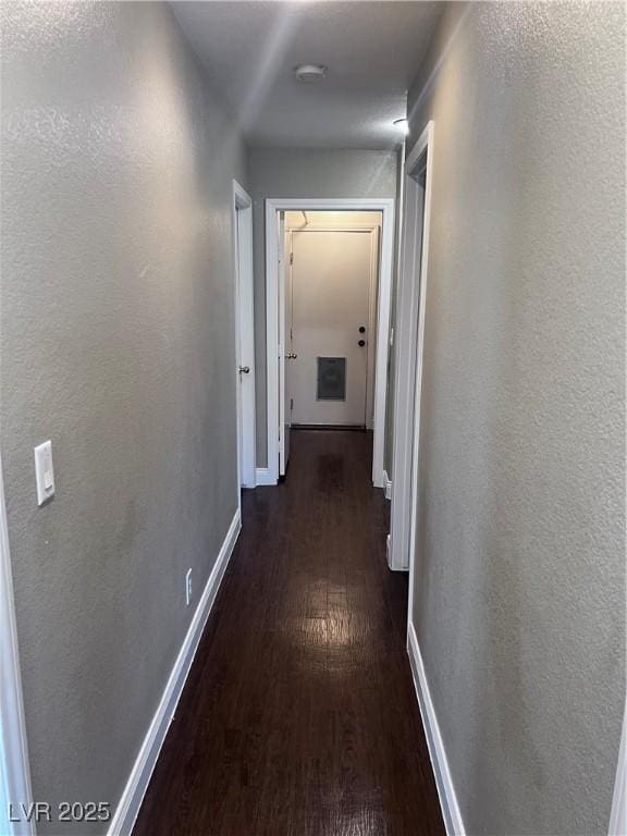 5217 Yellow Dawn Ct, Las Vegas, NV 89130 - hallway featuring dark wood finished floors and baseboards