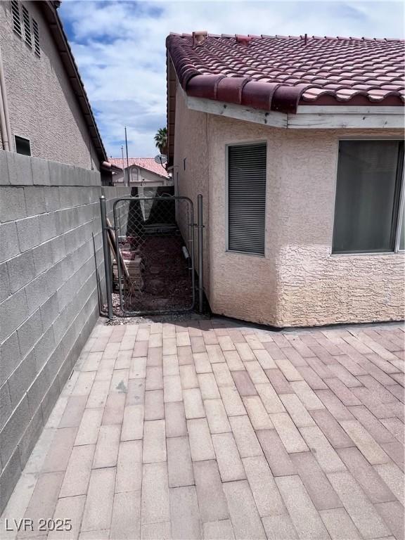 5217 Yellow Dawn Ct, Las Vegas, NV 89130 - view of patio featuring a gate