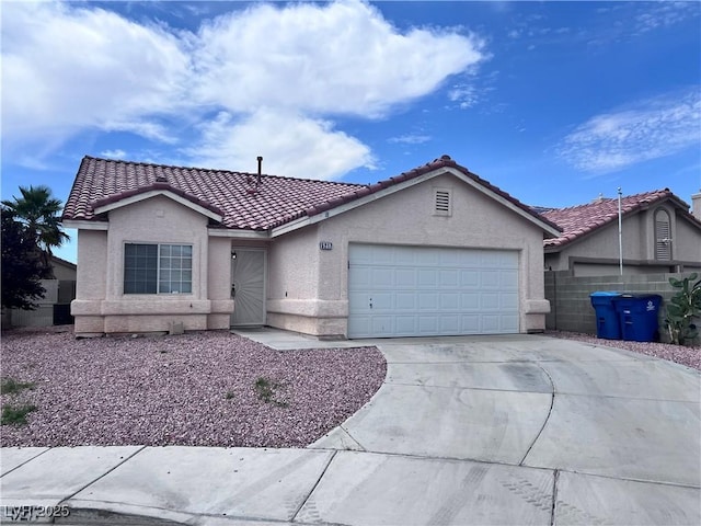 5217 Yellow Dawn Ct, Las Vegas, NV 89130 - ranch-style house featuring stucco siding, an attached garage, a tile roof, and concrete driveway