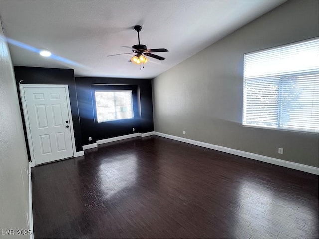 5217 Yellow Dawn Ct, Las Vegas, NV 89130 - spare room featuring ceiling fan, dark wood-type flooring, baseboards, and lofted ceiling