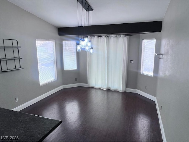 5217 Yellow Dawn Ct, Las Vegas, NV 89130 - unfurnished dining area featuring a chandelier, plenty of natural light, and dark wood finished floors