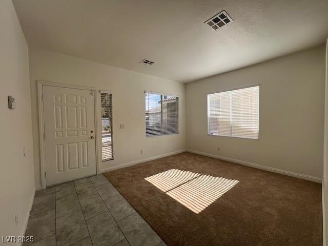 1030 Country Skies Ave, Las Vegas, NV 89123 - carpeted foyer entrance featuring baseboards and tile patterned flooring
