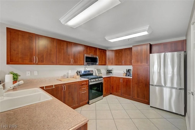 150 Las Vegas Blvd Unit 1503, Las Vegas, NV 89101 - kitchen featuring stainless steel appliances, a sink, light countertops, and light tile patterned flooring