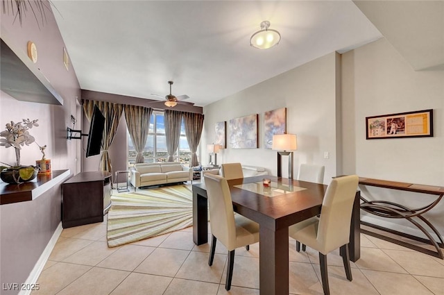 150 Las Vegas Blvd Unit 1503, Las Vegas, NV 89101 - dining area featuring light tile patterned floors, ceiling fan, and baseboards
