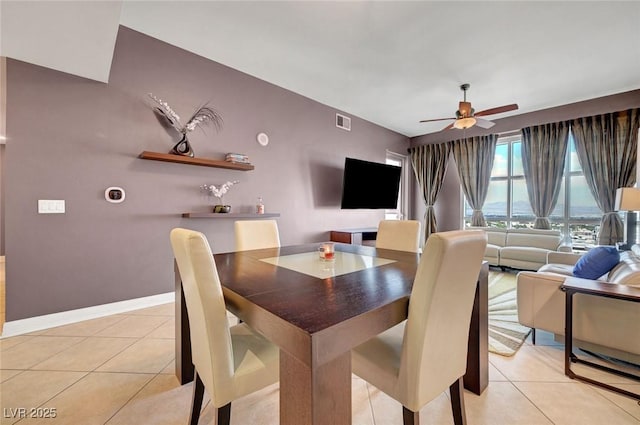 150 Las Vegas Blvd Unit 1503, Las Vegas, NV 89101 - dining room featuring light tile patterned floors, a ceiling fan, and baseboards