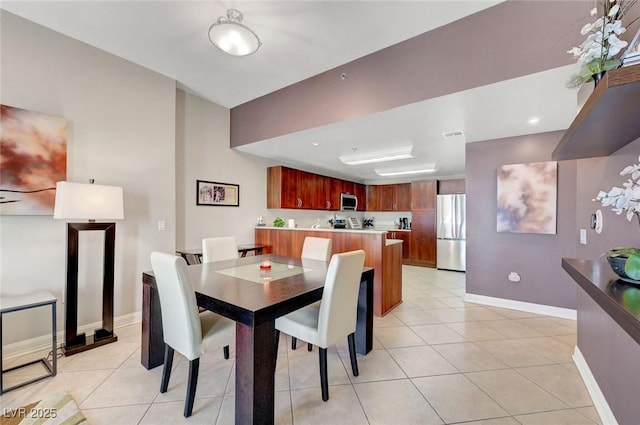 150 Las Vegas Blvd Unit 1503, Las Vegas, NV 89101 - dining room with baseboards and light tile patterned floors