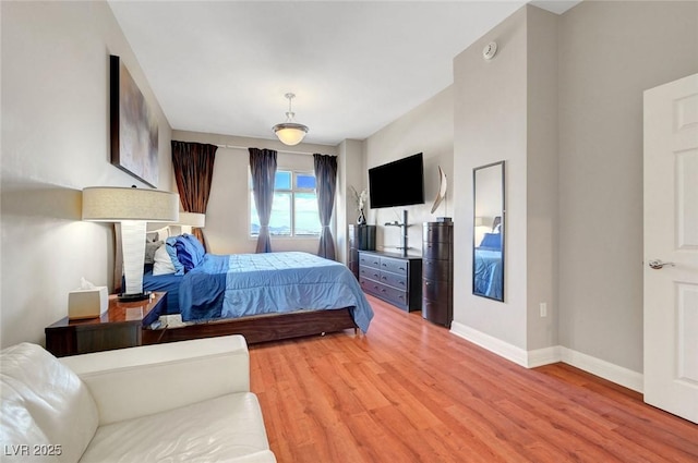 150 Las Vegas Blvd Unit 1503, Las Vegas, NV 89101 - bedroom featuring light wood finished floors and baseboards