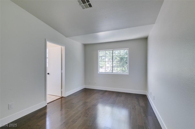 5330 E Charleston Blvd Unit 2, Las Vegas, NV 89142 - unfurnished room featuring dark wood-style flooring and baseboards