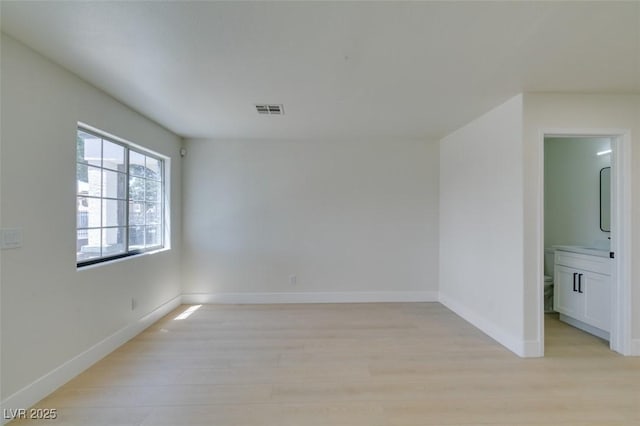 5330 E Charleston Blvd Unit 2, Las Vegas, NV 89142 - unfurnished room with light wood-type flooring and baseboards