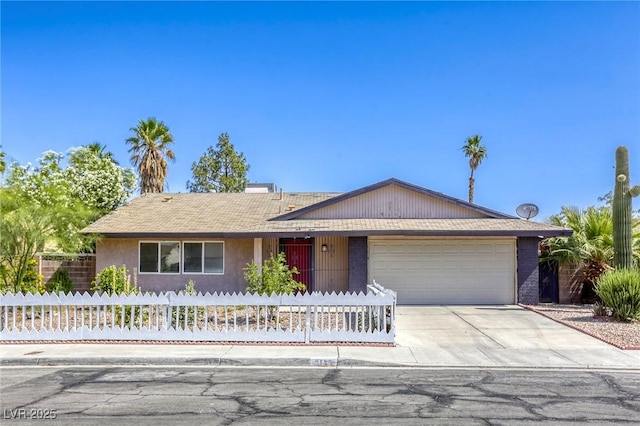 5132 Springland St, Las Vegas, NV 89146 - ranch-style house featuring a garage, concrete driveway, and stucco siding