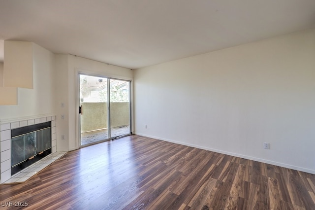 698 S Racetrack Rd Unit 1014, Henderson, NV 89015 - unfurnished living room with wood finished floors, a fireplace, and baseboards