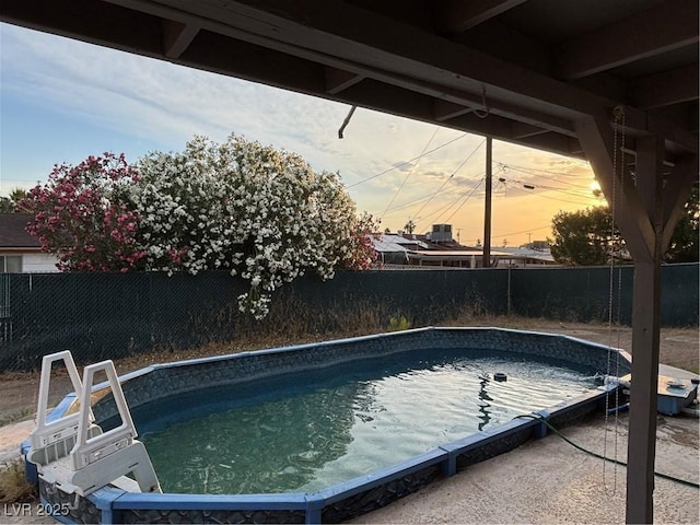 5920 Glen Eagles Ln, Las Vegas, NV 89108 - pool at dusk featuring a fenced backyard