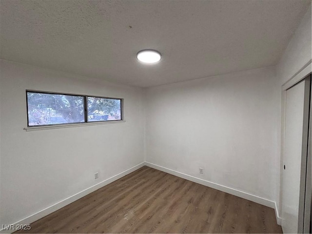 5920 Glen Eagles Ln, Las Vegas, NV 89108 - unfurnished bedroom with wood finished floors, baseboards, and a closet