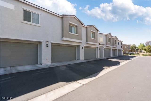 4566 Mansart Ct Unit 1104, North Las Vegas, NV 89031 - view of asphalt road featuring a residential view