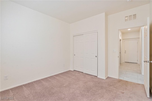 4566 Mansart Ct Unit 1104, North Las Vegas, NV 89031 - unfurnished bedroom with light colored carpet, a closet, and baseboards