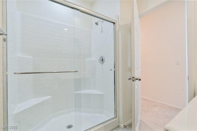 4566 Mansart Ct Unit 1104, North Las Vegas, NV 89031 - bathroom featuring a shower stall, tile patterned floors, and baseboards