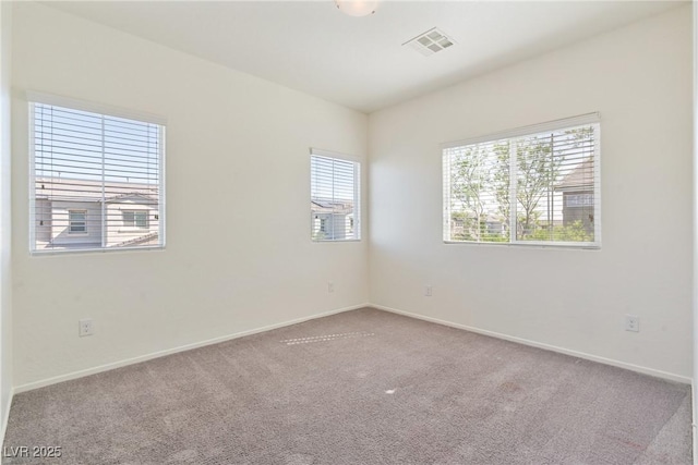4566 Mansart Ct Unit 1104, North Las Vegas, NV 89031 - empty room featuring healthy amount of natural light, carpet, and baseboards